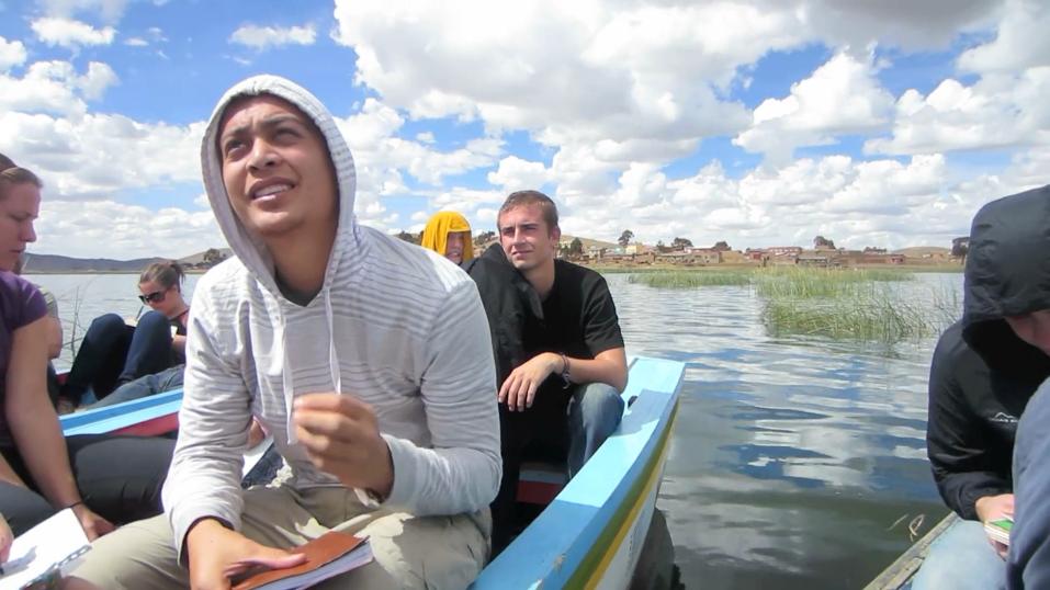 Students sitting on a boat